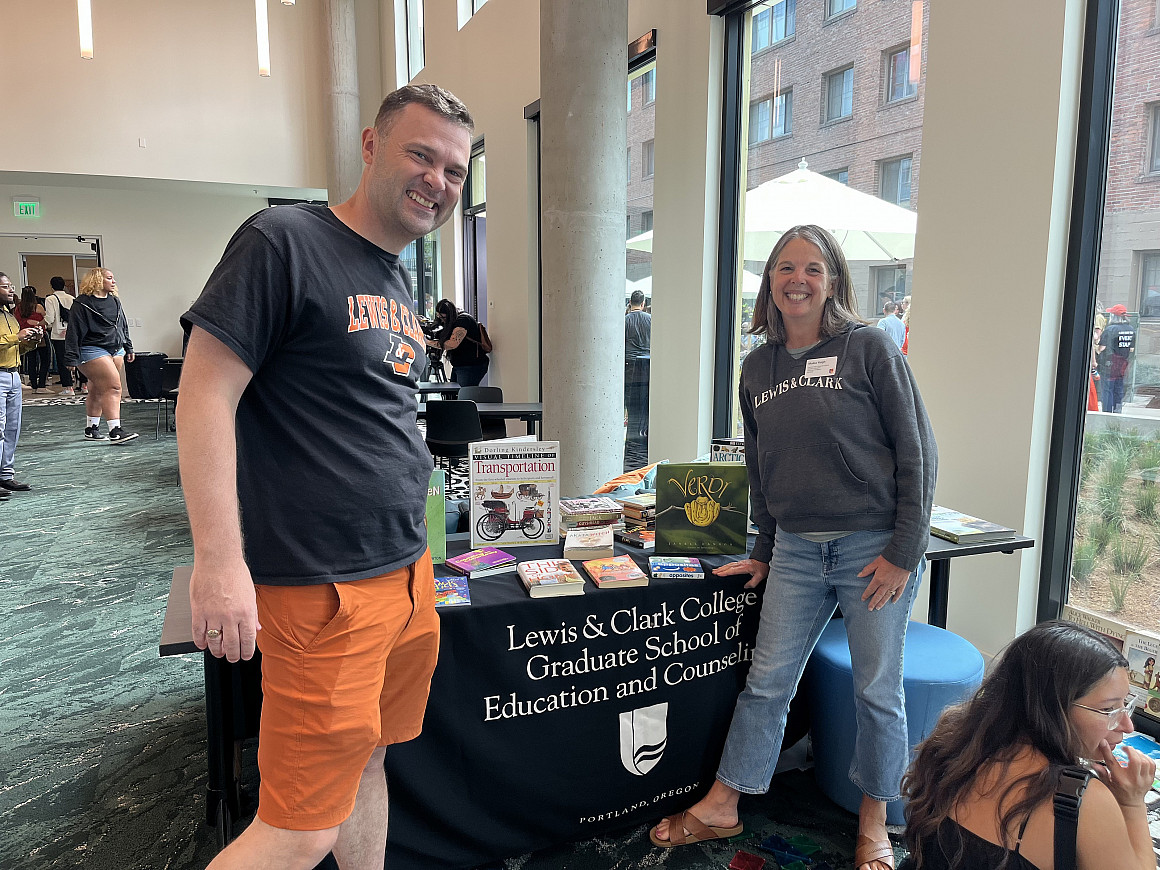 The graduate school dean and secondary MAT program director welcome visitors to the reading corner.