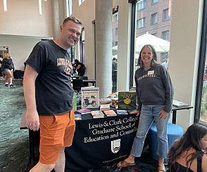 The graduate school dean and secondary MAT program director welcome visitors to the reading corner.