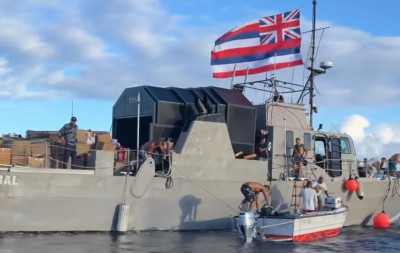 A fishing boat arrives from O'ahu, bringing supplies donated directly from the people of O'ahu.