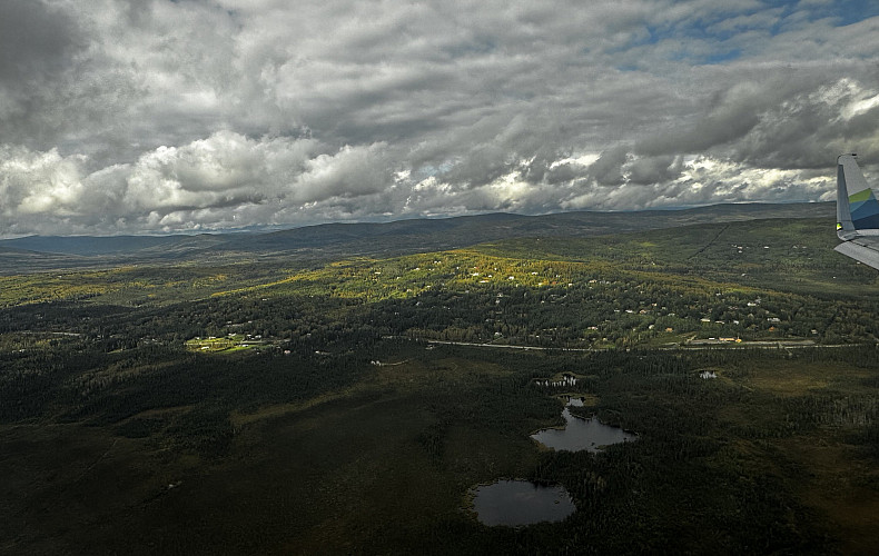 An aerial view from the bush plane of mountains and lakes flying in to Arctic Village.