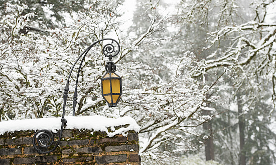 Exterior winter shot of campus with snow on the wall.